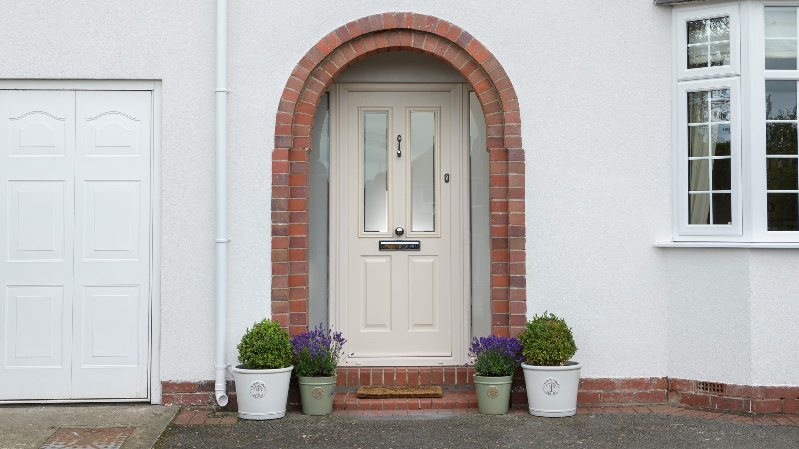 Cream front door with arched porch